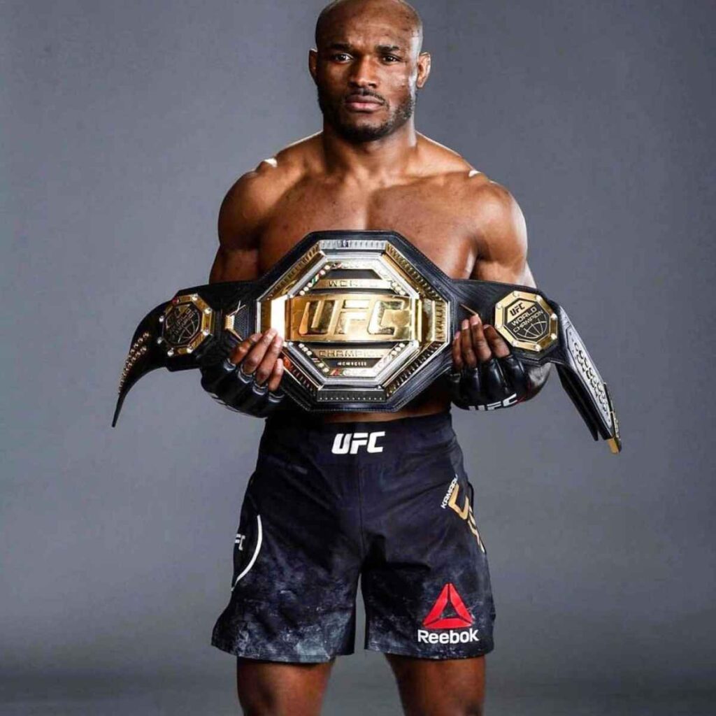 Kamaru Usman holding his UFC welterweight belt