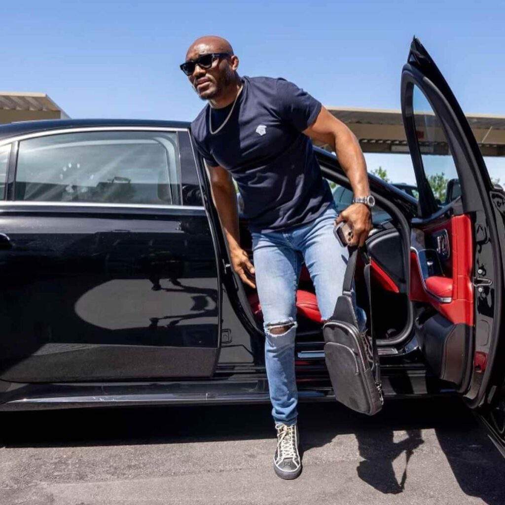 Kamaru Usman coming out of his luxurious car