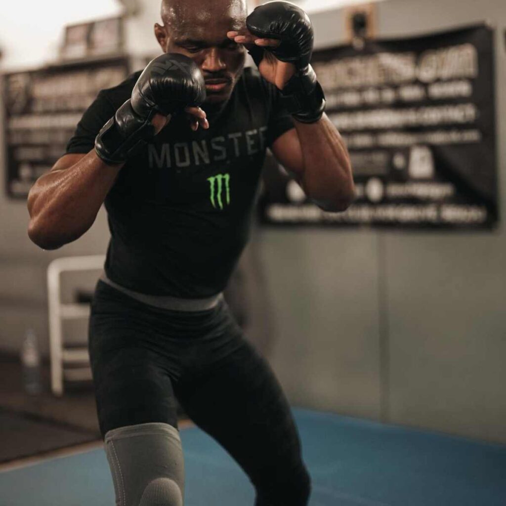 Kamaru Usman wearing a t-shirt with a logo of Monster Energy drink